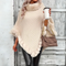 Poncho en tricot crème avec bordure en fausse fourrure