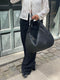 Borsa a mano in pelle intrecciata nera per donna