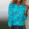 Blusa donna a maniche lunghe blu con motivo floreale colorato