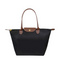 Sac à main en nylon noir avec poignées en cuir marron