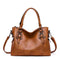 Borsa a mano in pelle marrone con tracolla removibile