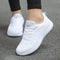 White women's sports shoes, laces, textured sole