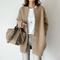Gilet en laine beige pour femme avec boutons pression
