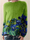 Maglione di lana verde con motivo floreale blu da donna