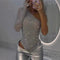 Body à paillettes argenté asymétrique manches longues