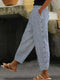 Pantalon rayé à boutons pour femme
