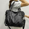 Sac à main en cuir noir avec bandoulière amovible