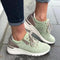 Green and beige women's sports shoe with laces