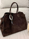 Brown suede handbag with handles and braided ornament