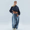 Navy blue women's hoodie with loose casual jeans