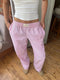 Pantalon de détente rose à rayures pour femme
