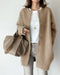 Gilet en laine beige pour femme avec boutons pression
