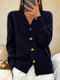 Cardigan in maglia nero con bottoni a forma di cuore
