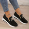 Black sports shoes with zipper and M logo