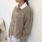 Cardigan en laine beige pour femme avec boutons